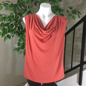 A beautiful coral colored blouse. Size Large.